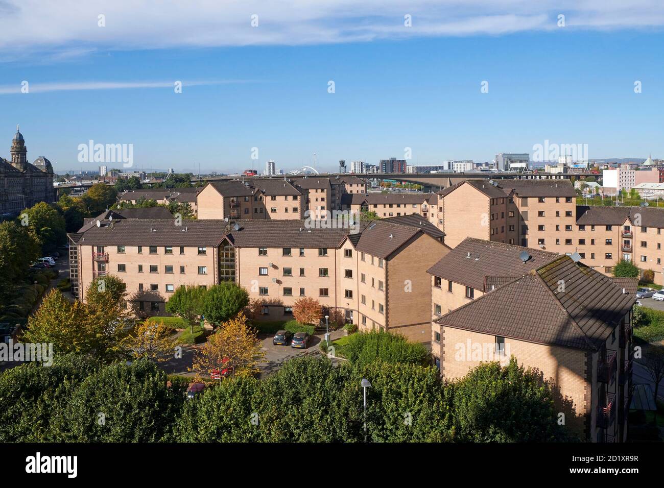 Looking over rooftops of Social housing towards the Clyde, at Tradestone, Glasgow, Central Scotland, UK Stock Photo