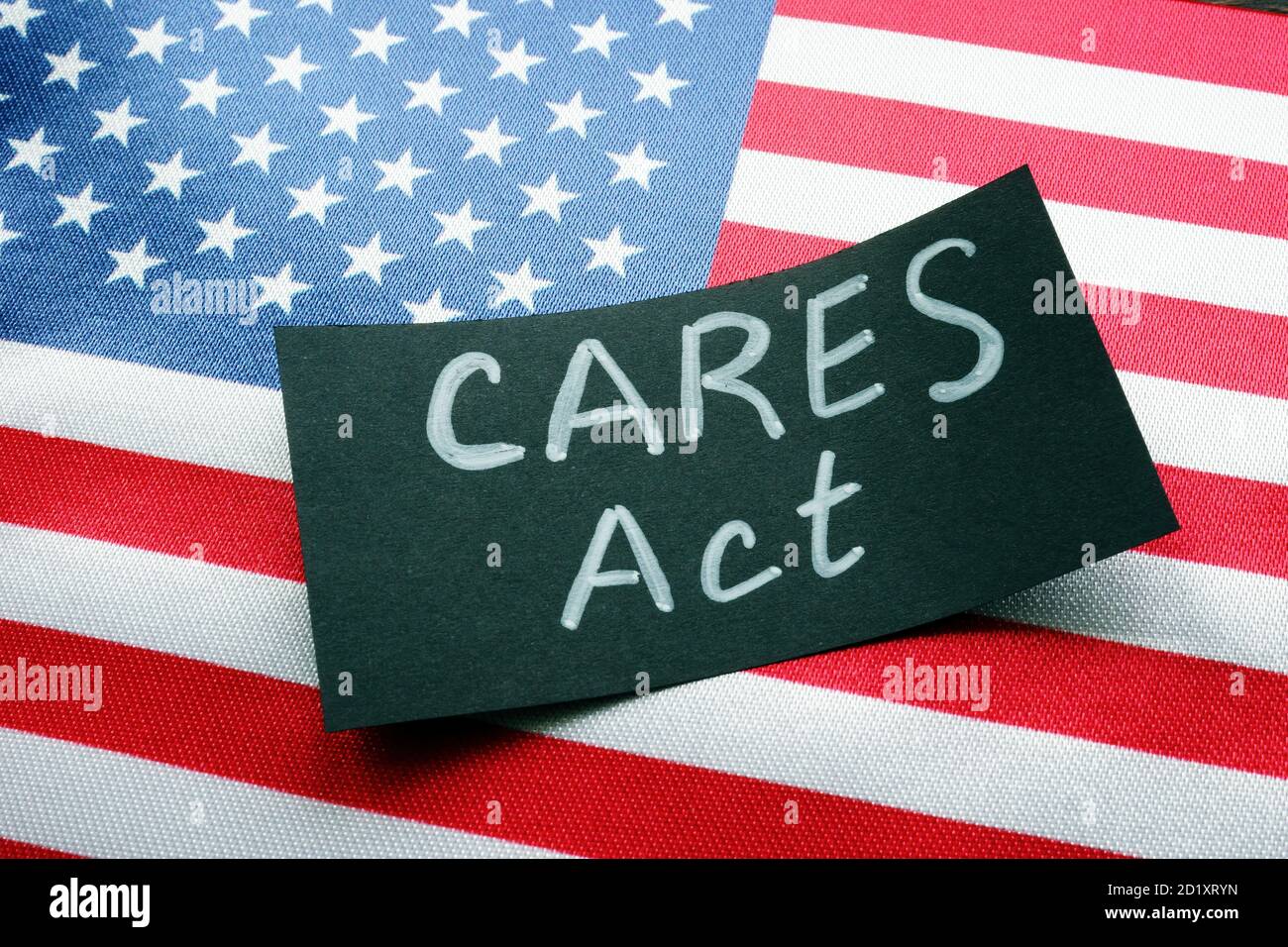 USA flag and word CARES act The Coronavirus Aid, Relief, and Economic Security Act. Stock Photo