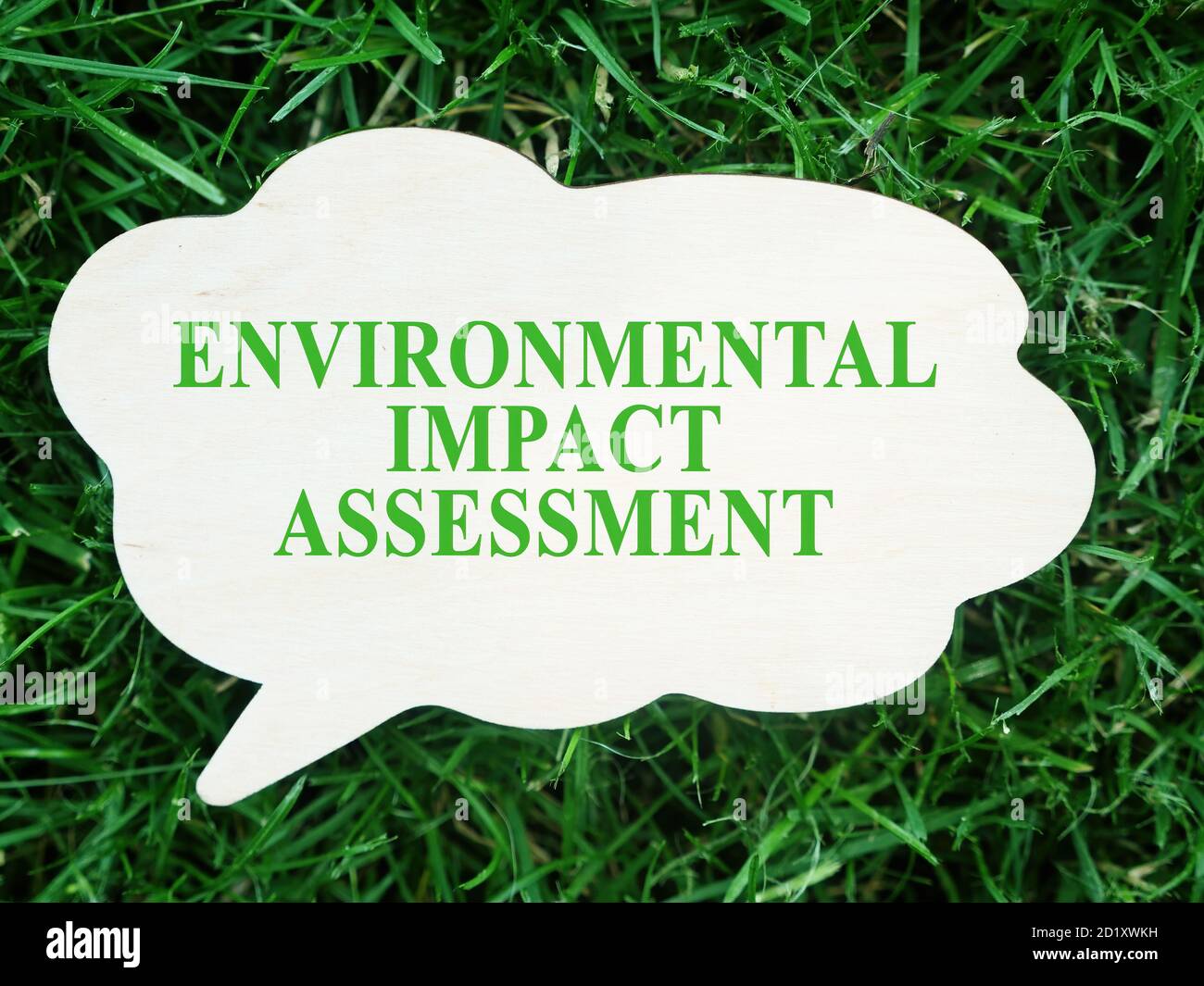 White plate with words Environmental impact assessment EIA. Stock Photo