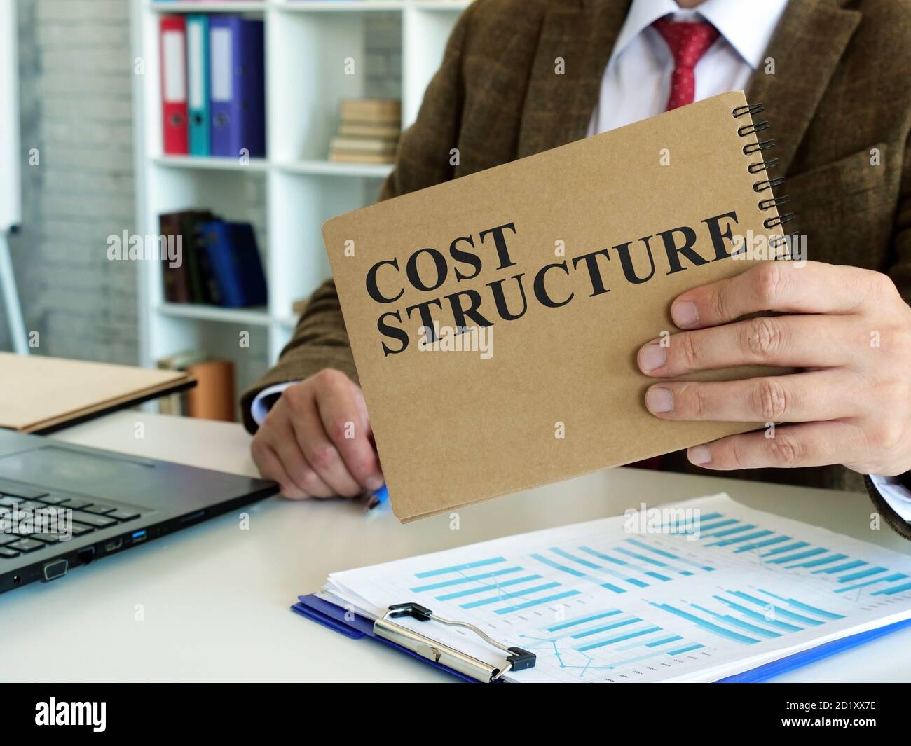 Cost structure concept. The manager makes financial calculations. Stock Photo