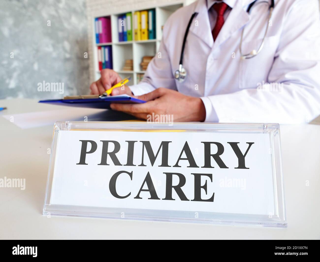 Primary care concept. The doctor writes down the medical history. Stock Photo