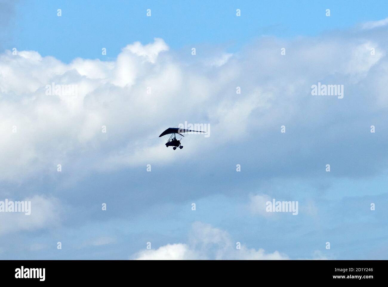 Microlite aircraft silhouetted against the sky, UK Stock Photo