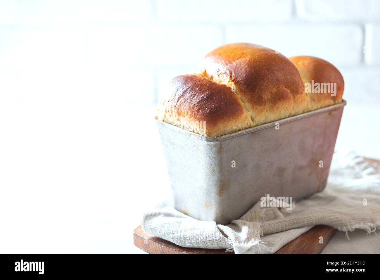 Japanese brioche, Japanese milk bread. Homemade baking. Fresh homemade crisp bread. Stock Photo