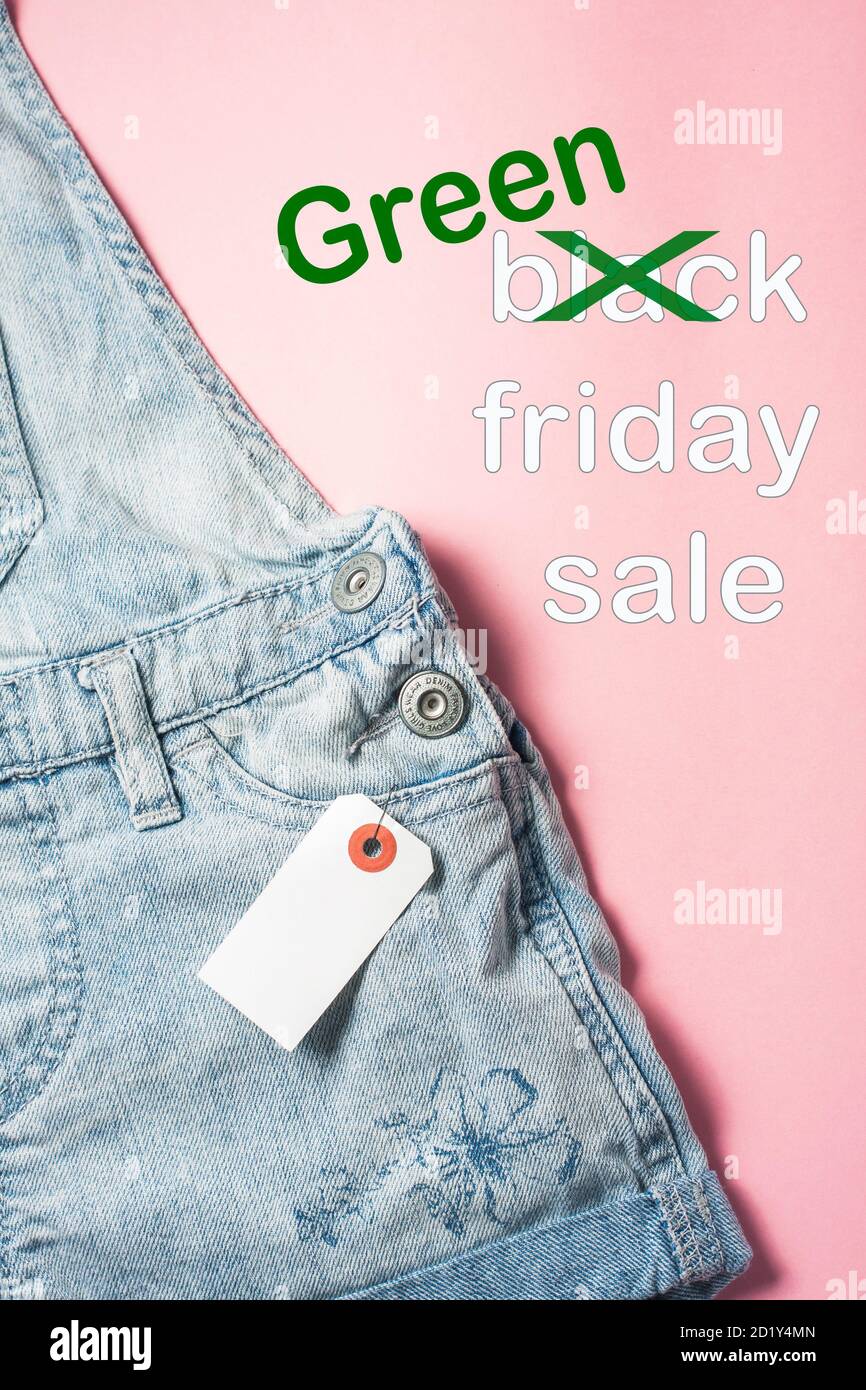 Text Black Friday Sale with word Black crossed out to be exchanged on Green Stock Photo