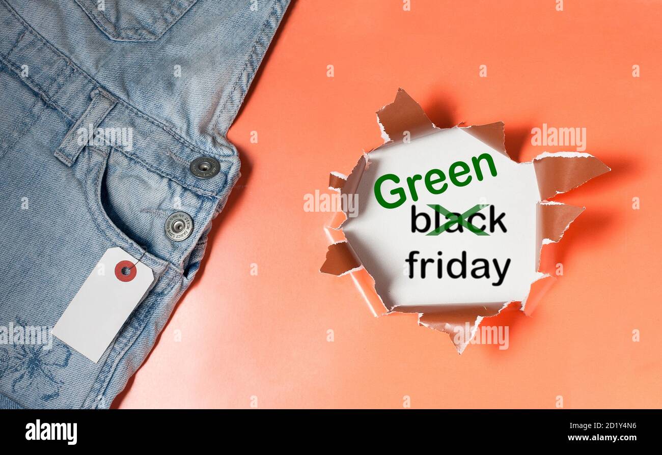 Text Black Friday Sale with word Black crossed out to be exchanged on Green Stock Photo