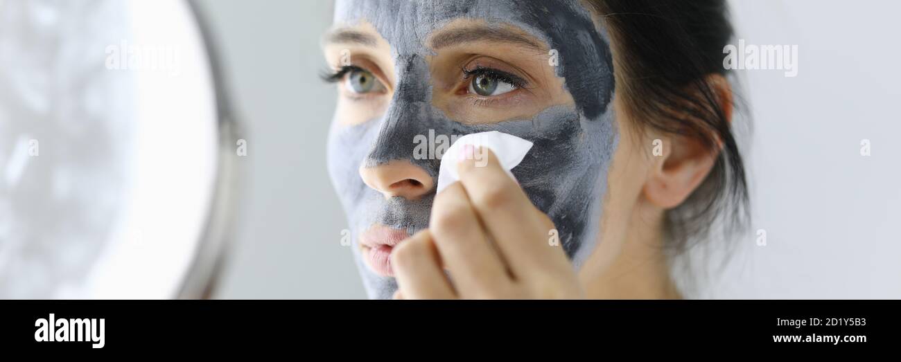 Woman peeling off face mask hi-res stock photography and images - Alamy