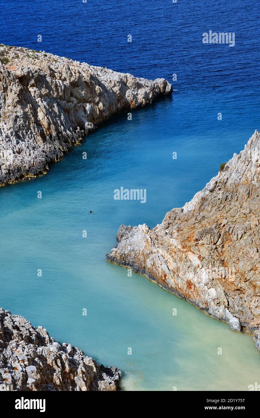 Sharp Z-shaped bay, cliffs, sea shores, crystal azure water. Natural geometry. Close shot. Seitan Limania, Akrotiri, Chania, Crete island, Greece Stock Photo