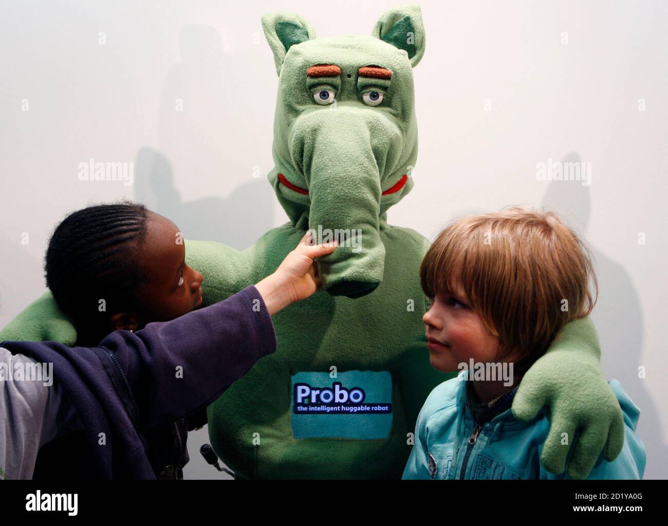 Children pose with Probo, the "intelligent huggable" robot, at the  unveiling of the first prototype in Brussels, April 21, 2009. Probo was  designed to interact with humans and will assist in providing