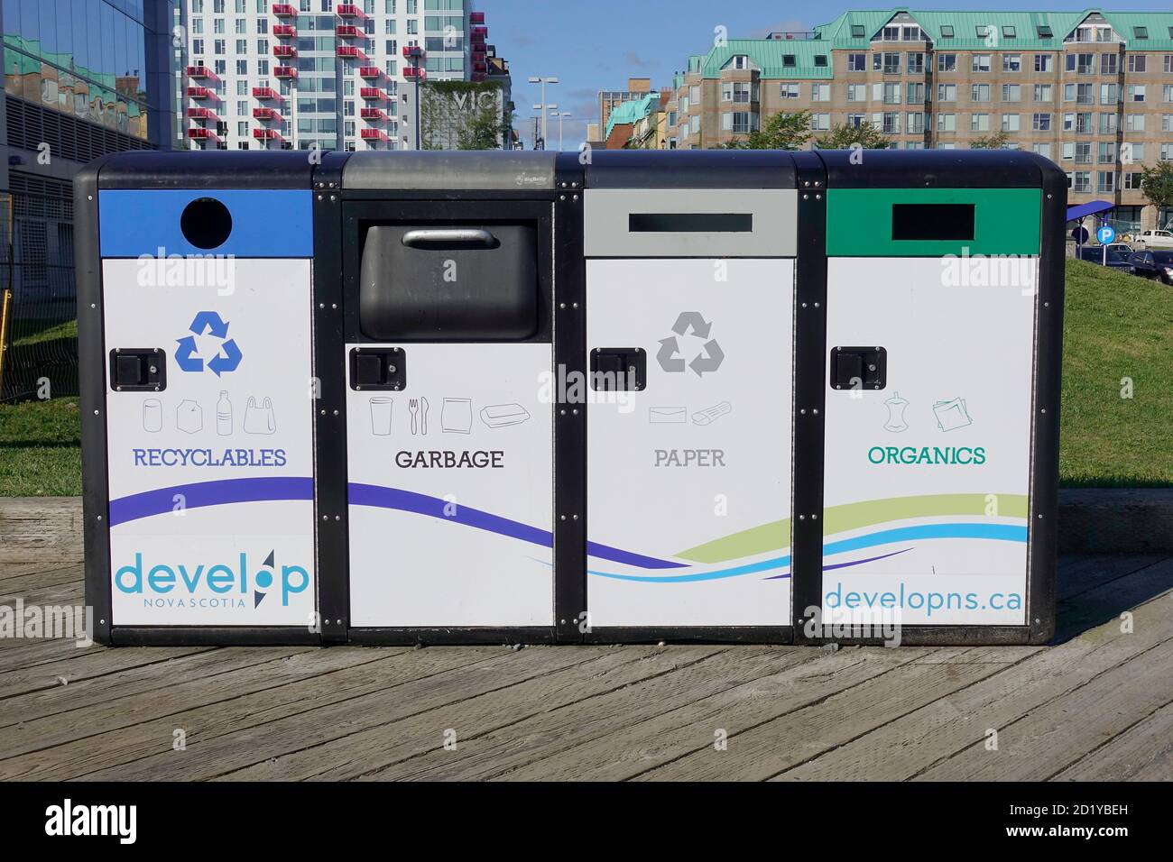 Modern Seperated Public Recycling Litter Bins For Organics Recyclables Paper And Garbage On The Boardwalk In Halifax Nova Scotia Canada Stock Photo