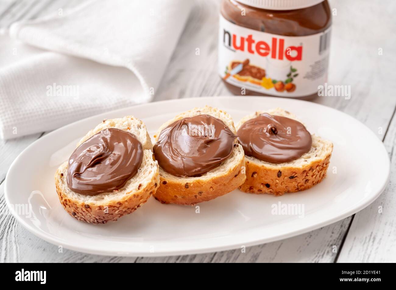 SUMY, UKRAINE - OCT 04, 2020:  Slices of bread with nutella - world famous Italian hazelnut cocoa spread Stock Photo