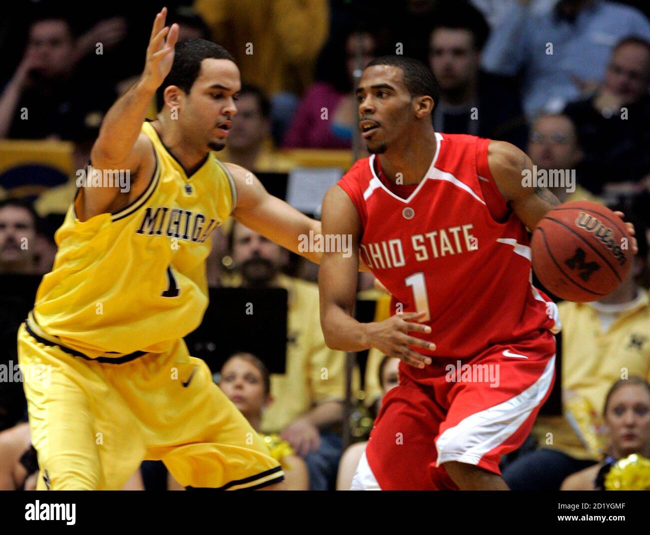 Ohio State Mike Conley Jr. (R) drives around University of Michigan Jerret  Smith during the second half of their NCAA basketball game in Ann Arbor,  Michigan March 3, 2007. REUTERS/Rebecca Cook (UNITED