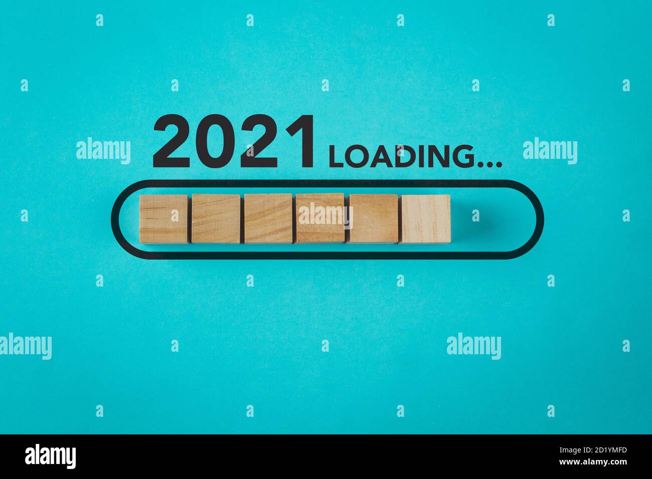 Loading new year 2021 with wood cube in progress bar. Stock Photo