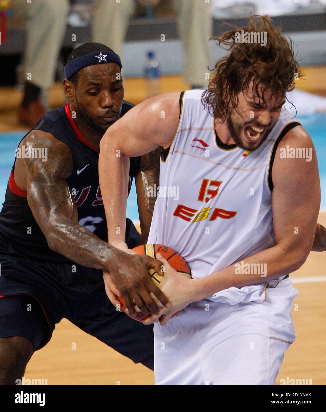 Lebron James Of The U S L Grabs The Ball From Marc Gasol Of Spain During Their