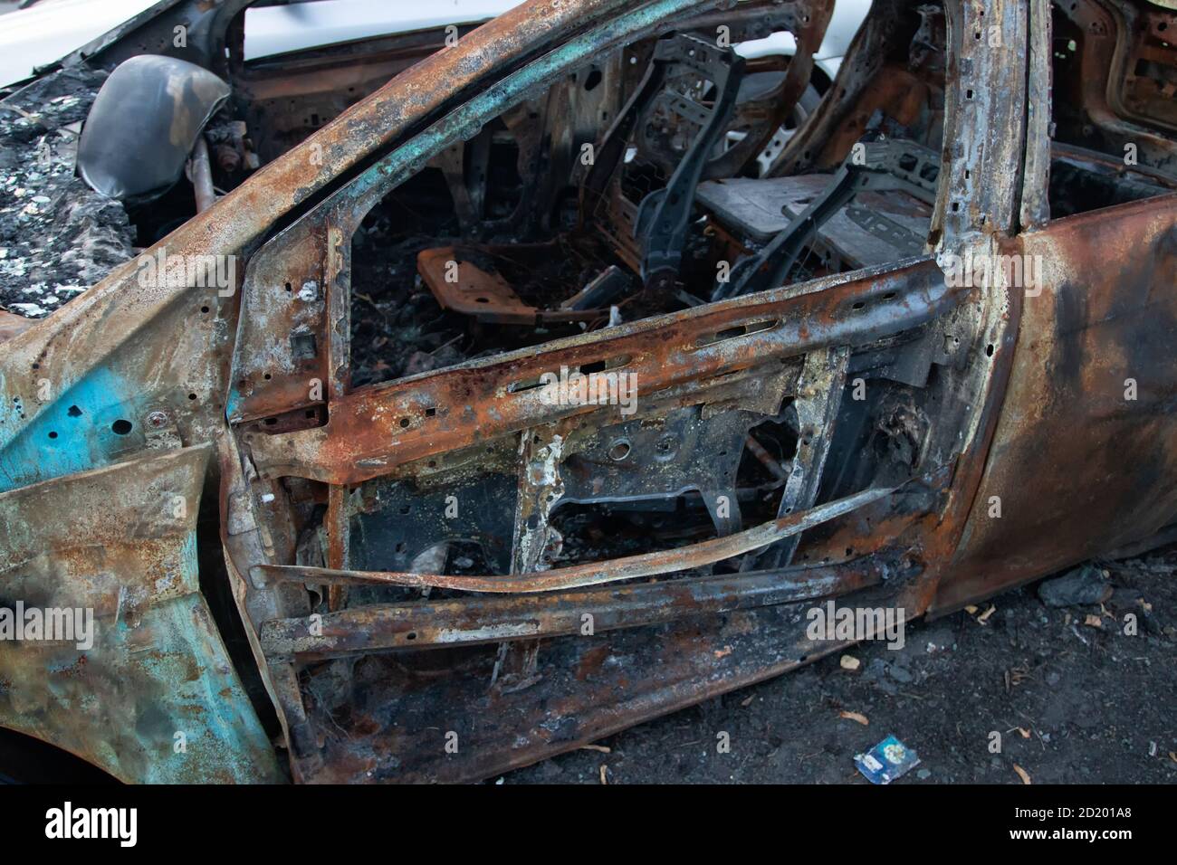 car burned down in a parking lot Stock Photo