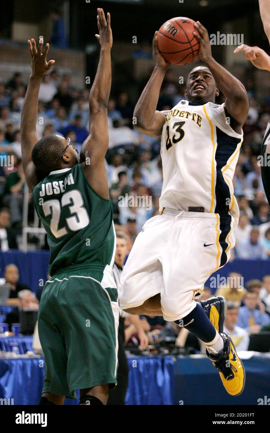 Marquette University guard Wesley Matthews (R) shoots over Michigan State University guard Maurice Joseph in the first half of their NCAA First Round East Regional basketball game in Winston-Salem, North Carolina March 15, 2007.  REUTERS/Tami Chappell  (UNITED STATES) Stock Photo