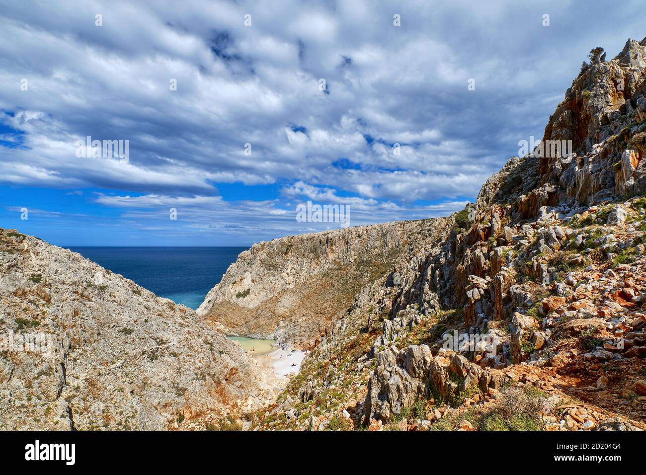 Rocky cliffs of typical Greek sea shores, blue sea, blue sky, beautiful sky. Stefanou beach, Seitan Limania, Chania region, Crete island, Greece Stock Photo