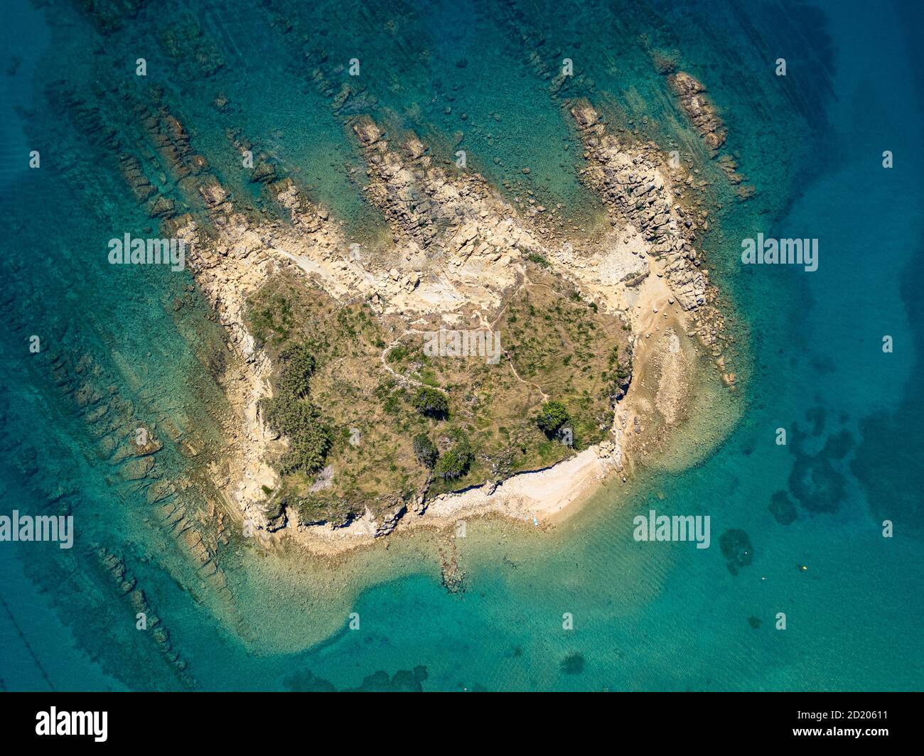 Topdown photo of the small rocky island on the Rajska beach on the Rab island in Croatia. Paradise beach on the island of Rab in Croatia Stock Photo