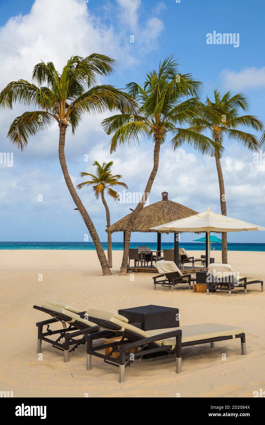 Caribbean, Netherland Antilles, Aruba, Manchebo beach, Sunloungers outside Bucuti and Tara Resort Stock Photo
