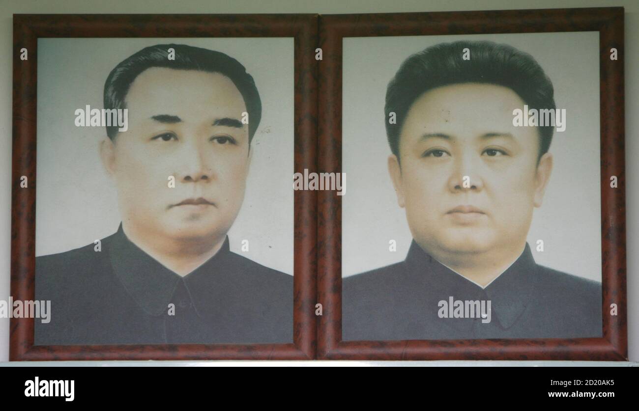 Portraits Of North Korea Founder Kim Il Sung L And His Son And Current Leader Kim Jong Il Are Hung At A Mock North Korean School Classroom Displayed For Tourists At An Observation Post