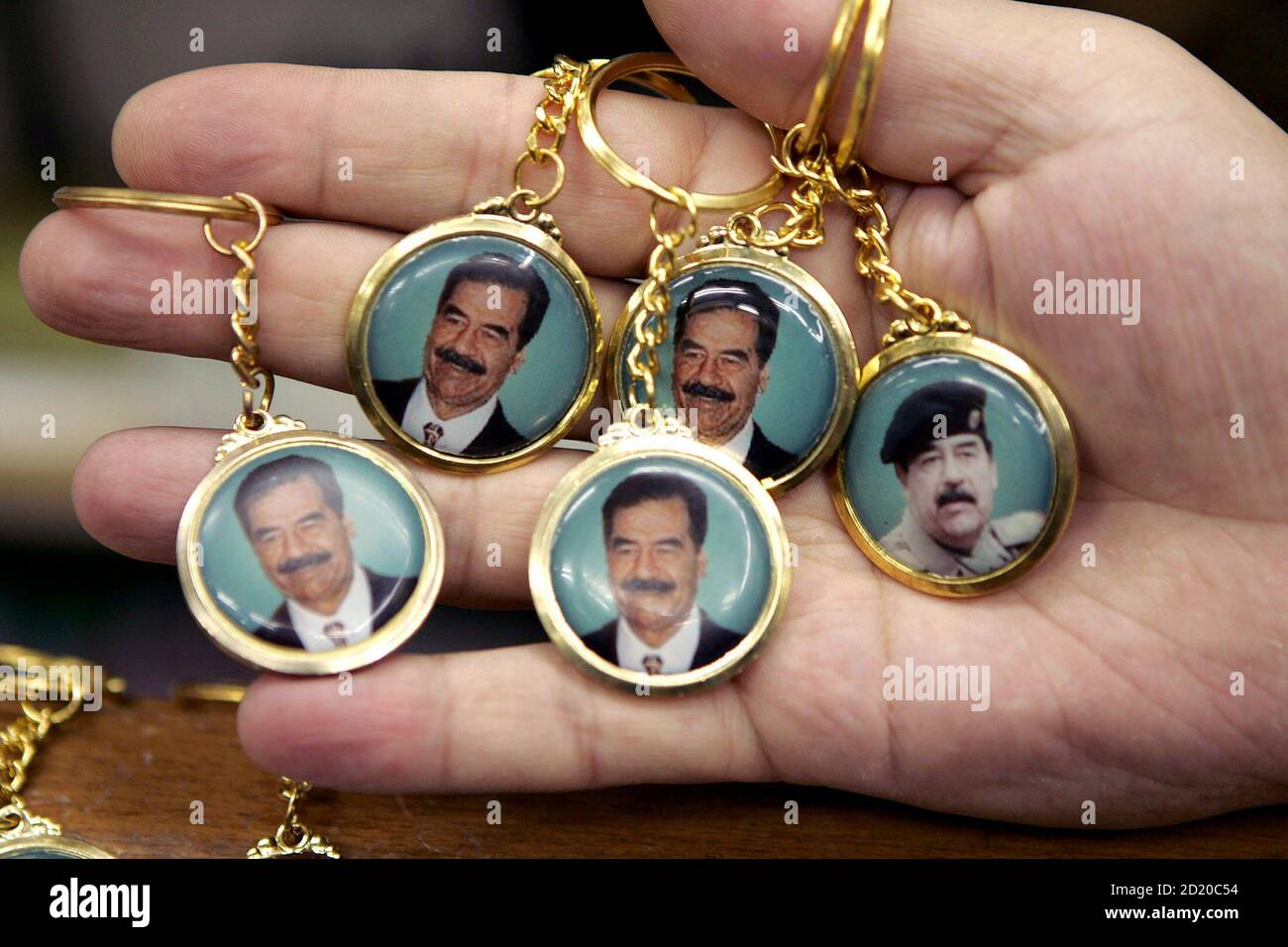 Key Chains Decorated With Pictures Of Former Iraqi President Saddam Hussein For Sale In Downtown Amman October 19 05 Almost Two Years After His Capture Former Iraqi President Saddam Hussein Will Be
