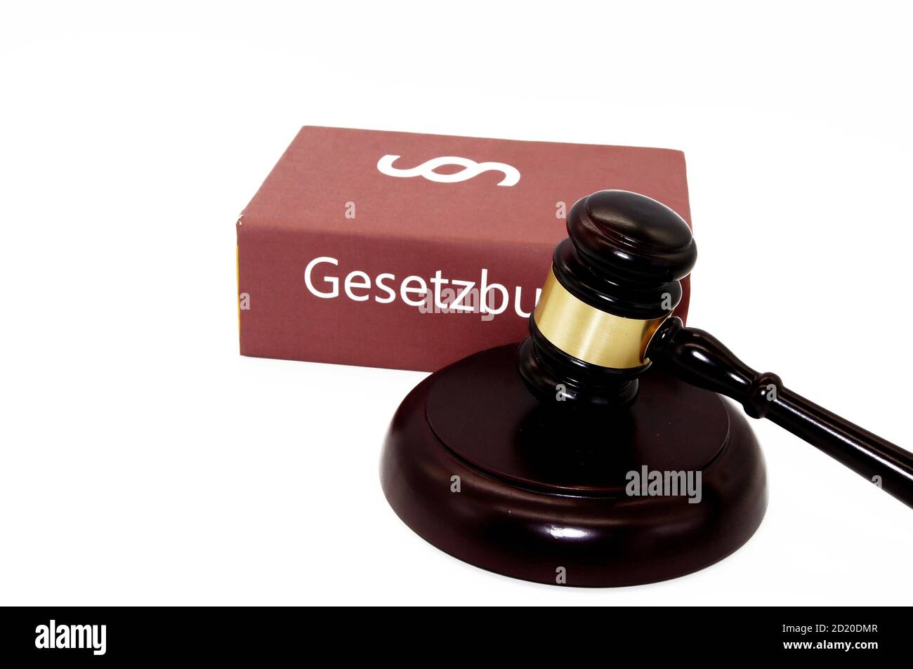 Closeup of a wooden gavel with the Gesetzbuch - code of law isolated on a white background Stock Photo