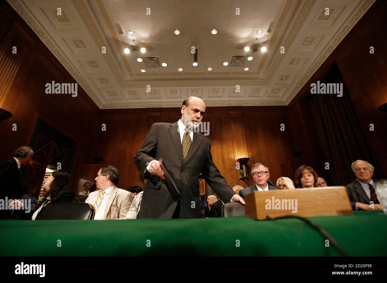 U.S. Federal Reserve Chairman Ben Bernanke arrives at a Senate Banking, Housing and Urban Affairs committee hearing on Capitol Hill, July 19, 2007. Bernanke said on Thursday he remains optimistic top U.S. banking regulators will reach a consensus on an international capital adequacy plan under the Basel II framework.         REUTERS/Jason Reed      (UNITED STATES) Stock Photo