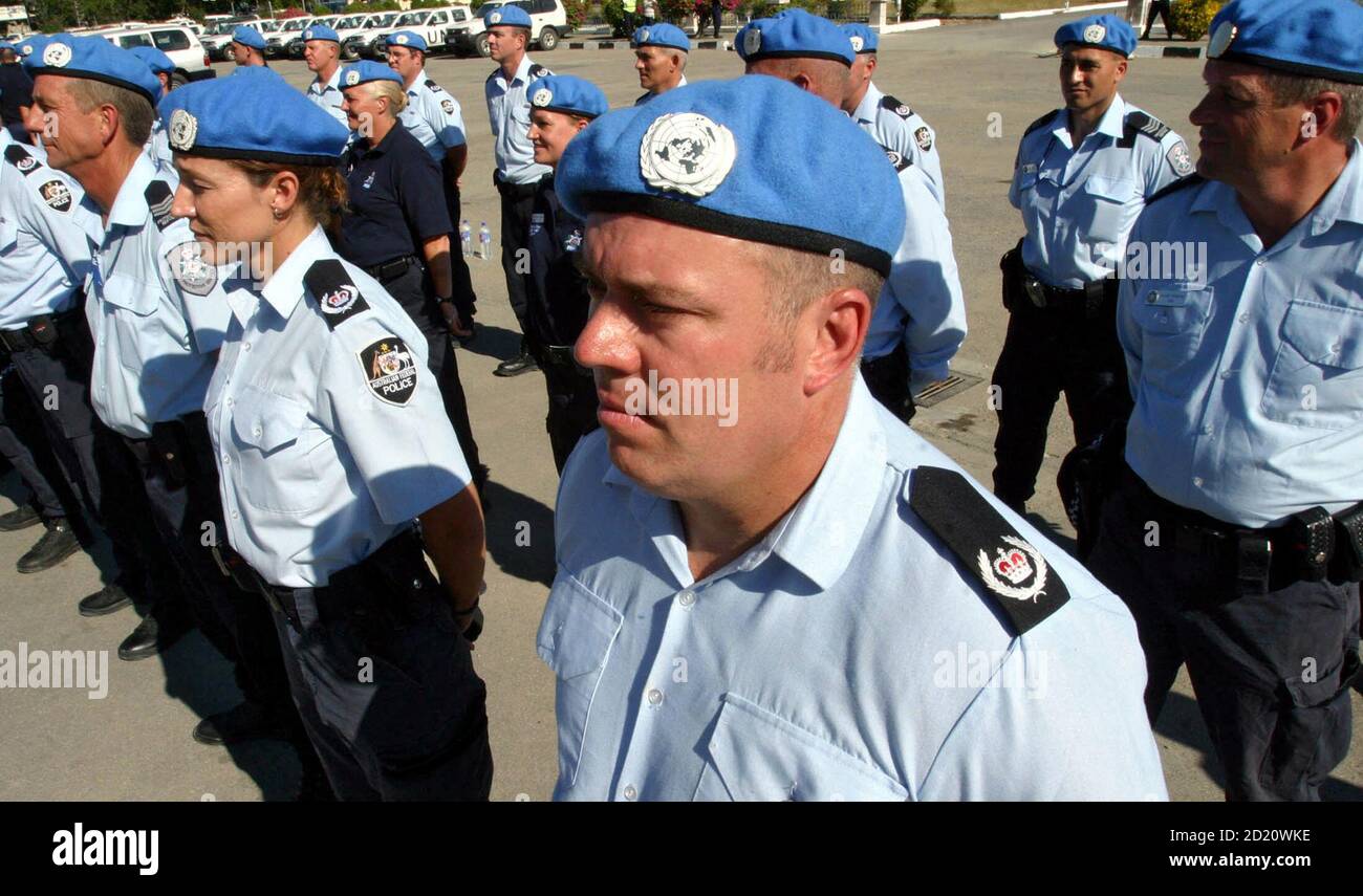 Members of the International Police from Australia wear United Nations  police outfit during a ceremony in Dili, East Timor September 13, 2006. The  ceremony formally marked the transfer of some 500 International