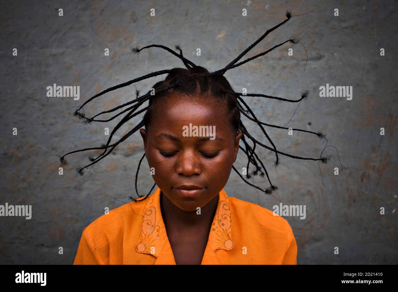 Serafin Nyanzaba, 17, who has been displaced by war, wears a newly done  traditional Congolese hair style at the Don Bosco center in Goma, in this  November 20, 2008 file photo. More