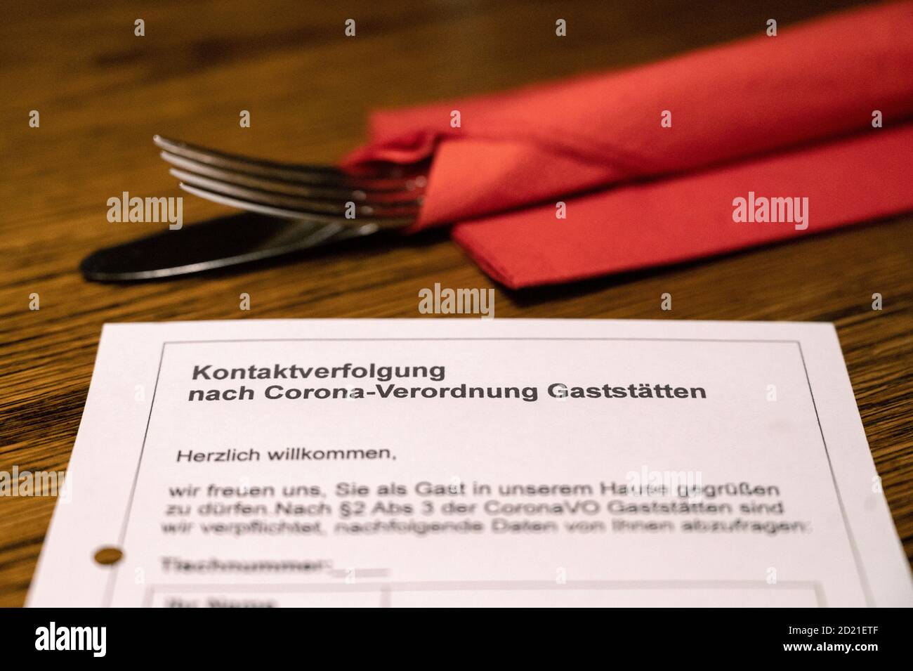 Stuttgart, Germany. 06th Oct, 2020. A sheet for contact tracing in restaurants according to the Corona Regulation is placed on a table in a restaurant. At a press conference, Baden-Württemberg's Minister of Health Lucha emphasised the importance of tracing infection chains. Therefore, he said, the proper completion of the tracing slips is also being increasingly controlled in restaurants and pubs. (to dpa 'Baden-Wuerttemberg raises alarm - tightened corona controls') Credit: Marijan Murat/dpa/Alamy Live News Stock Photo