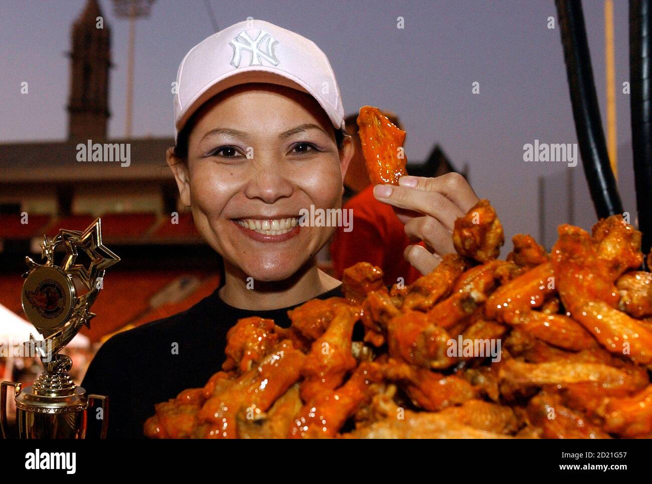 "The Black Widow" Thomas celebrates after taking first place in the National Wing Festival chicken wing eating contest in Buffalo, New York August 30, 2008. REUTERS/Gary Wiepert (UNITED STATES Stock Photo -