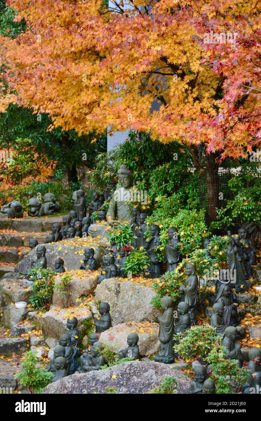 Statues of the followers of Buddha (called Shaka Nyorai in Japan at Daisho-in Temple (Daishoin Temple), Miyajima, Japan. Stock Photo
