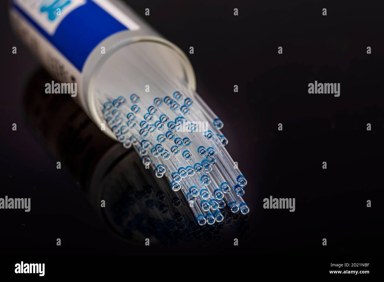Hematocrit Capillary Tube. Medical capillary glass tubes on black