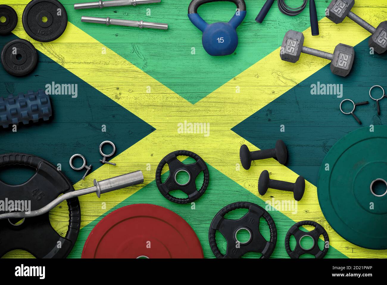 Jamaica sports and fitness concept. Top view of heavy weight plates