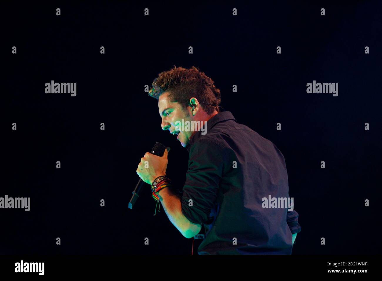 Spain's pop singer David Bisbal performs during a concert of his 'Premonition' tour in the northern Spanish town of Santander August 5, 2007. REUTERS/Victor Fraile (SPAIN) Stock Photo