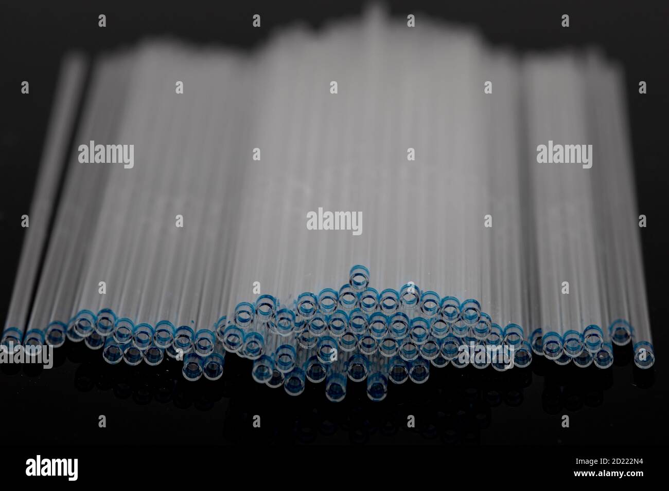Hematocrit Capillary Tube. Medical capillary glass tubes on black