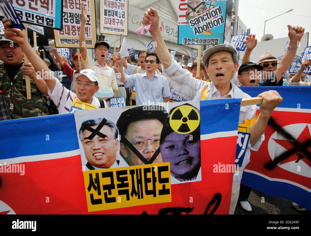 Conservative Protesters Shout Slogans As They Hold North Korean Flags And Portraits Of North Korean Leader Kim Jong Il Family During An Anti North Korea Rally Denouncing The North S Missile Launch And Former South