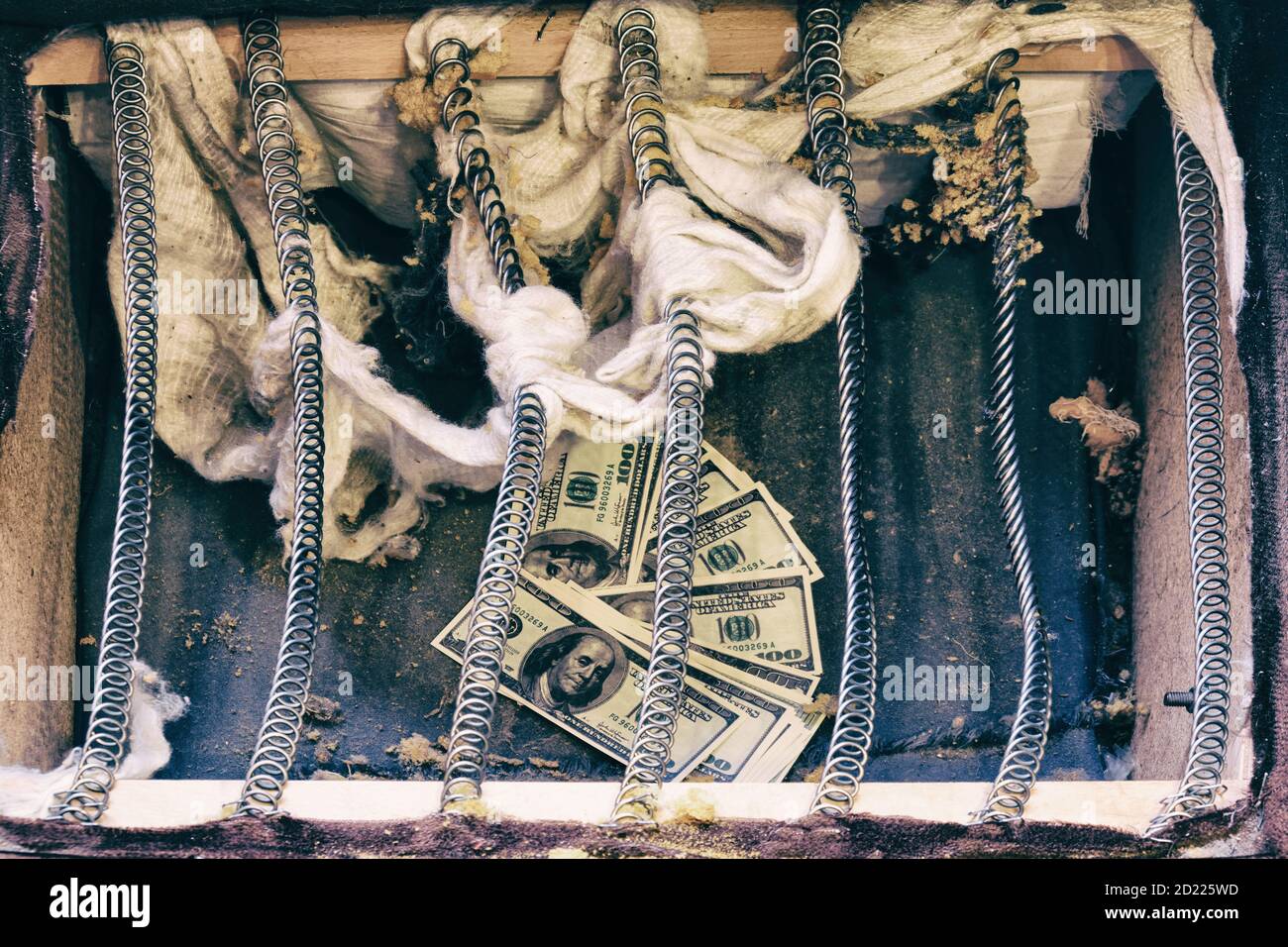 Money is hidden in an old spring sofa. Stash of us dollars in ancient ...