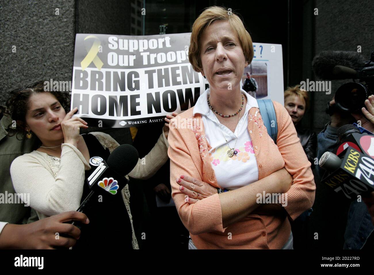 Iraq war protester Cindy Sheehan (R) speaks to the media outside the office of Senator Dianne Feinstein in San Francisco, California, September 9, 2005. Sheehan, who says her focus now will be Congress, met with staff of Senator Feinstein to discuss the war in Iraq. REUTERS/Kimberly White KW Stock Photo