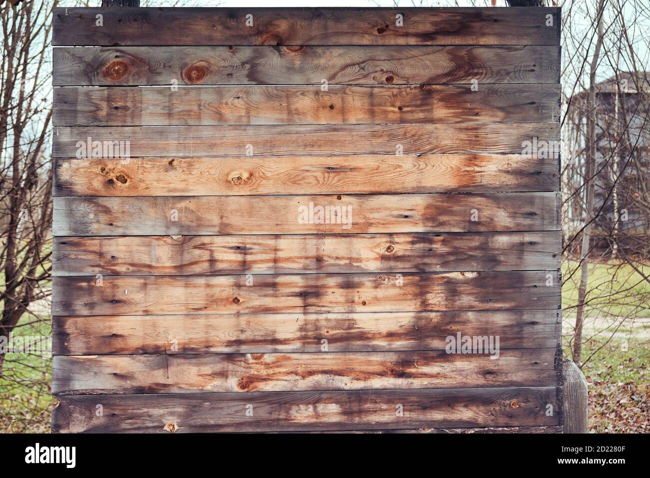 Old wooden notice board, closeup. Stand for putting up ads, copy space