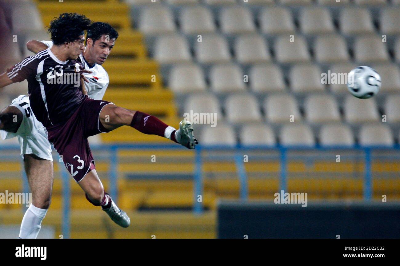 Qatar S Sebastian Soria L Fights For The Ball With Haider Abdul Hamid Of Iraq During Their Friendly Soccer Match In Doha October 16 07 Reuters Fadi Al Assaad Qatar Stock Photo Alamy