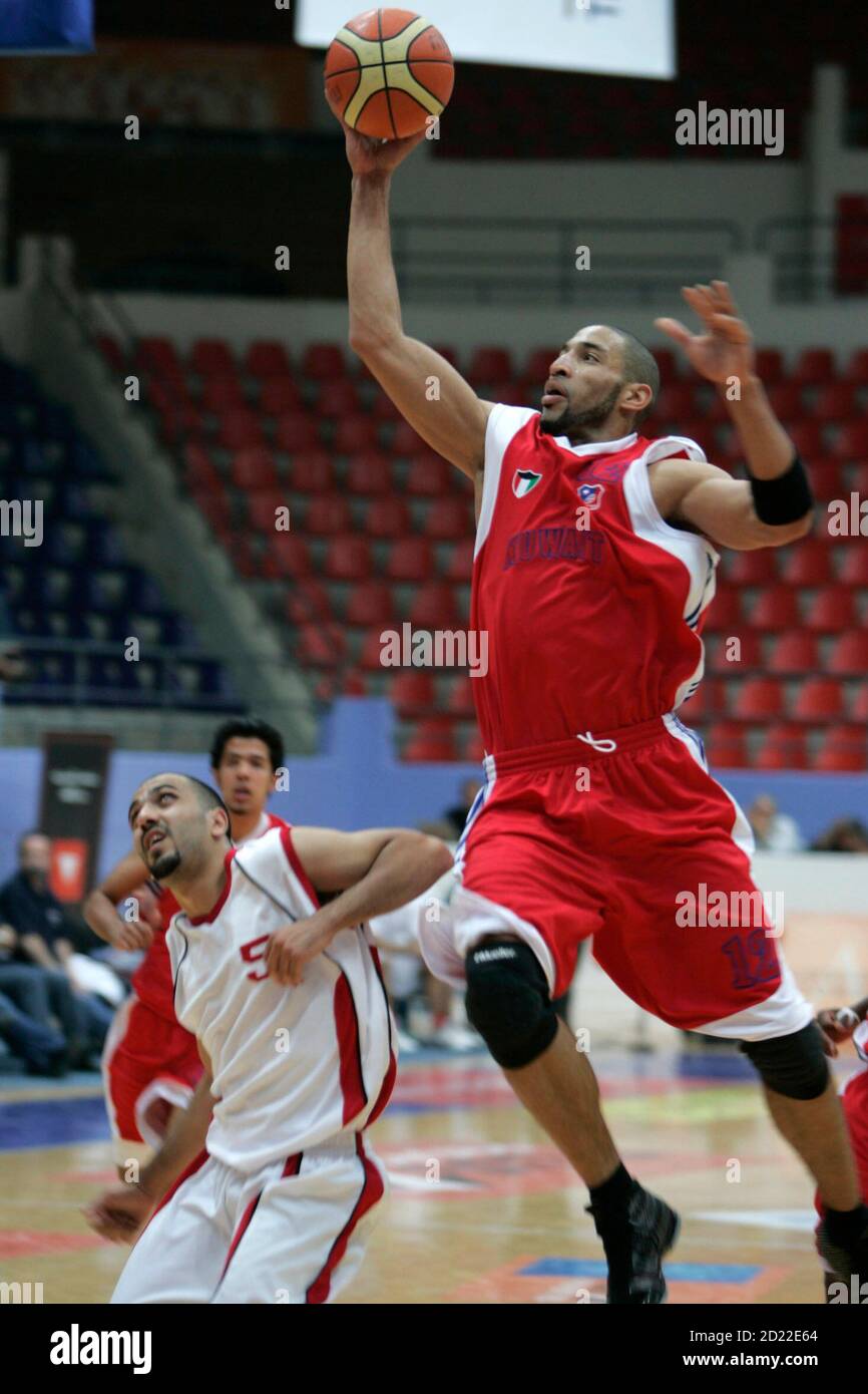 Ara Clarck of Kuwait's Al-Kuwait goes to the basket against Robert Anderson of Jordan's Orthodox during their Arab Clubs Basketball Championship match in Amman May 2, 2008.   REUTERS/Muhammad Hamed  (JORDAN) Stock Photo