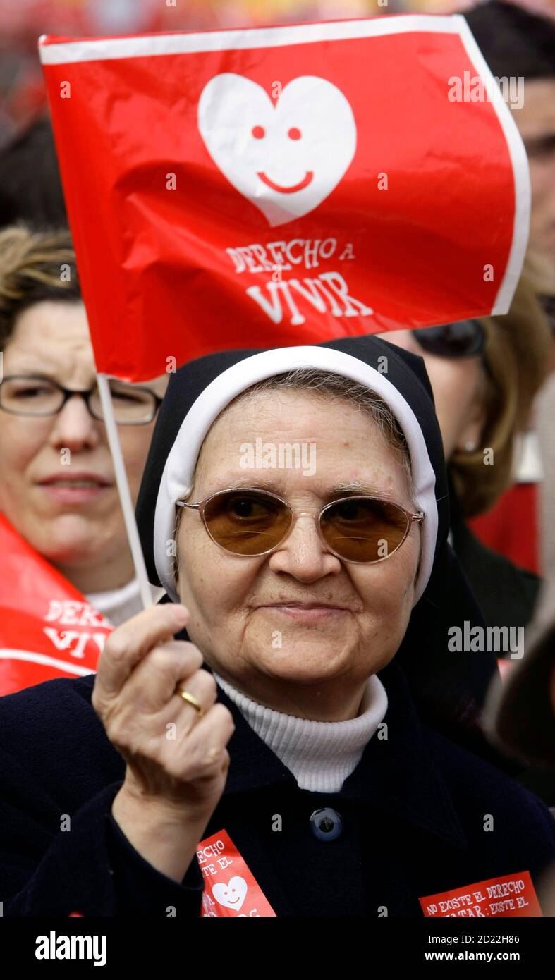 A Catholic Nun Holds A Flag As She Takes Part In An Anti Abortion Protest Called By Several Spanish Pro Life Groups In Central Madrid March 29 09 The Flag Reads Right To Life