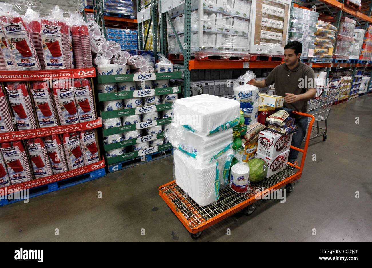 A shopper loads his cart at a Costco Wholesale store in Arlington, Virginia  August 6, 2009. Costco Wholesale Corp reported a bigger-than-expected 7  percent fall in July same-store sales hurt mainly by