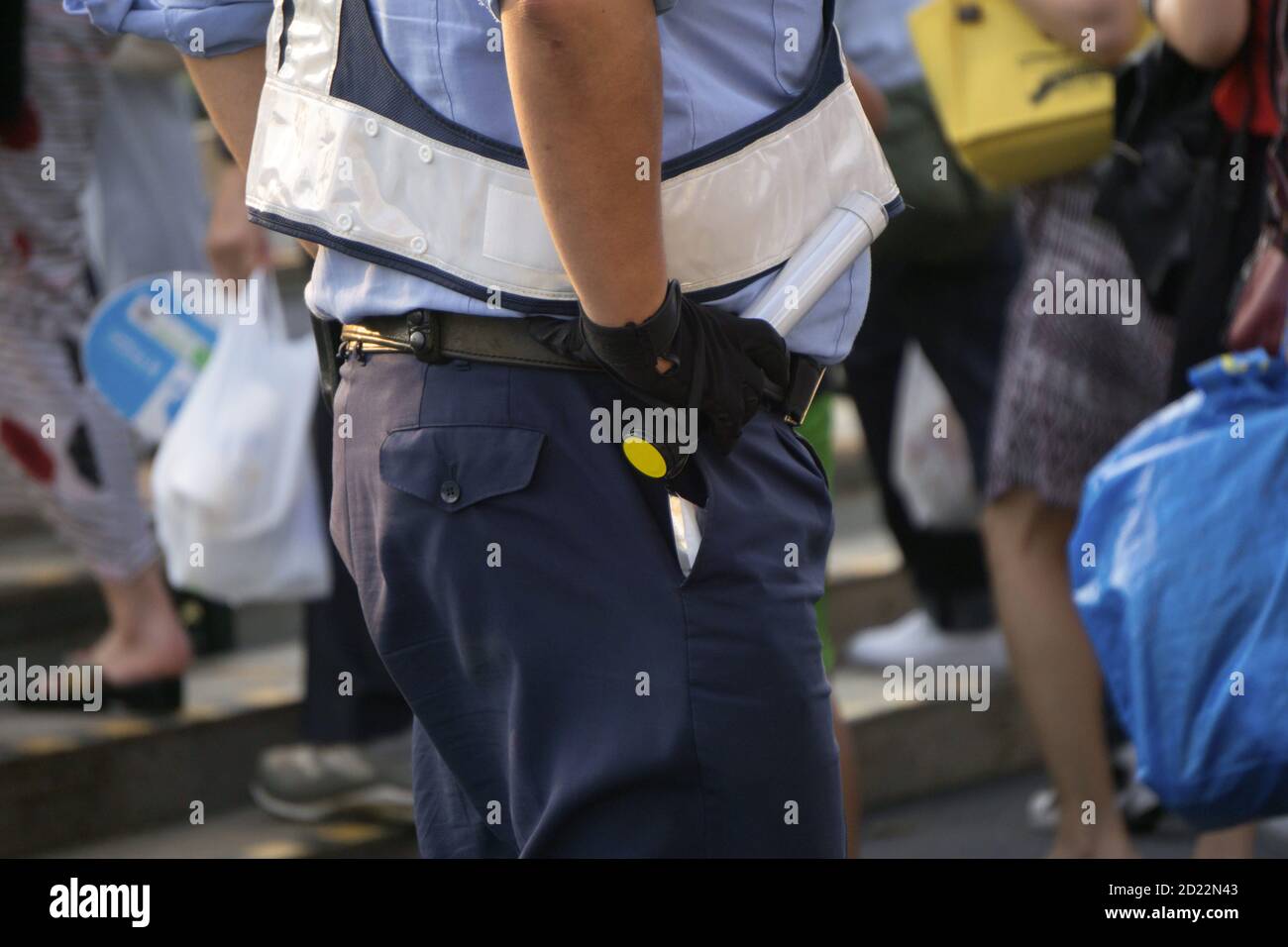 Japanese police officer in street Stock Photo