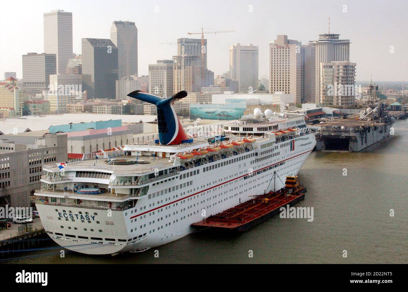 The Carnival Cruise Ship Ecstasy Is Moored Behind The Uss Iwo Jima In New Orleans Louisiana September 14 2005 The Ecstasy Is Housing Federal Emergency Management Agency Employees Responding To Hurricane Katrina