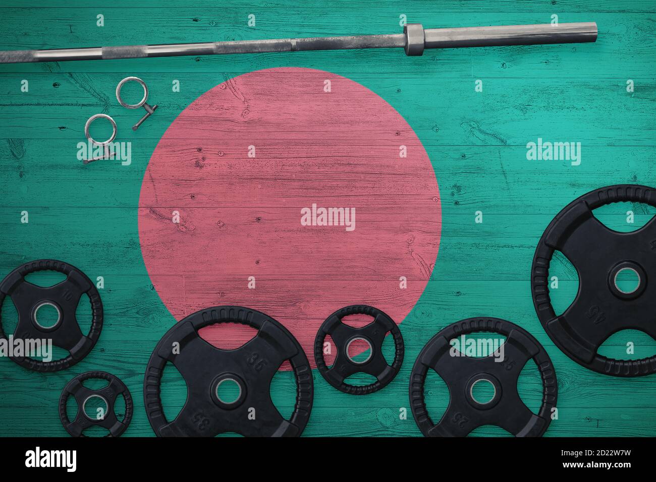 Bangladesh gym concept. Top view of heavy weight plates with iron bar