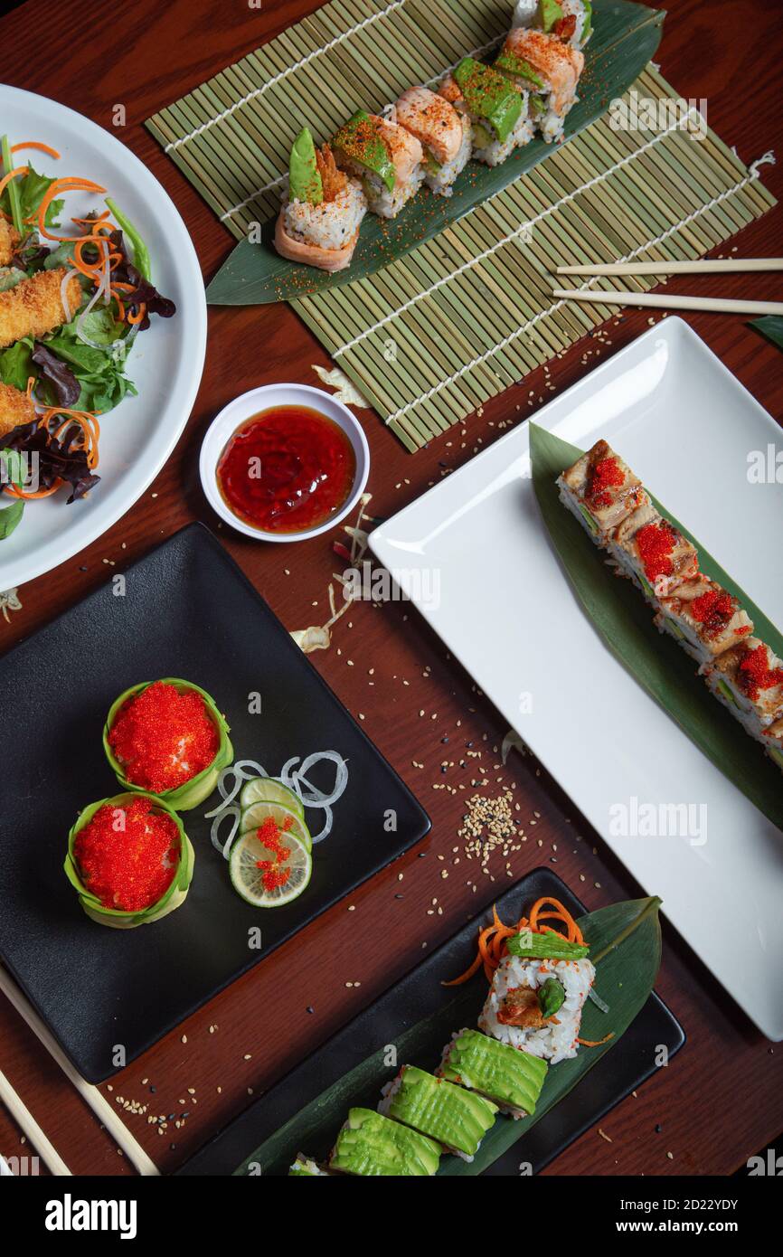 Variety of Japanese food dishes served on the restaurant table. Vertical image. Aerial view Stock Photo