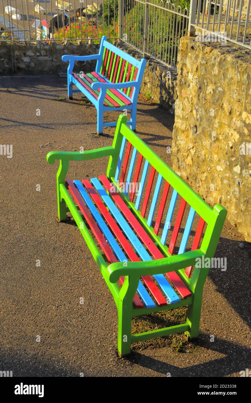 Two very colorful benches in park Stock Photo