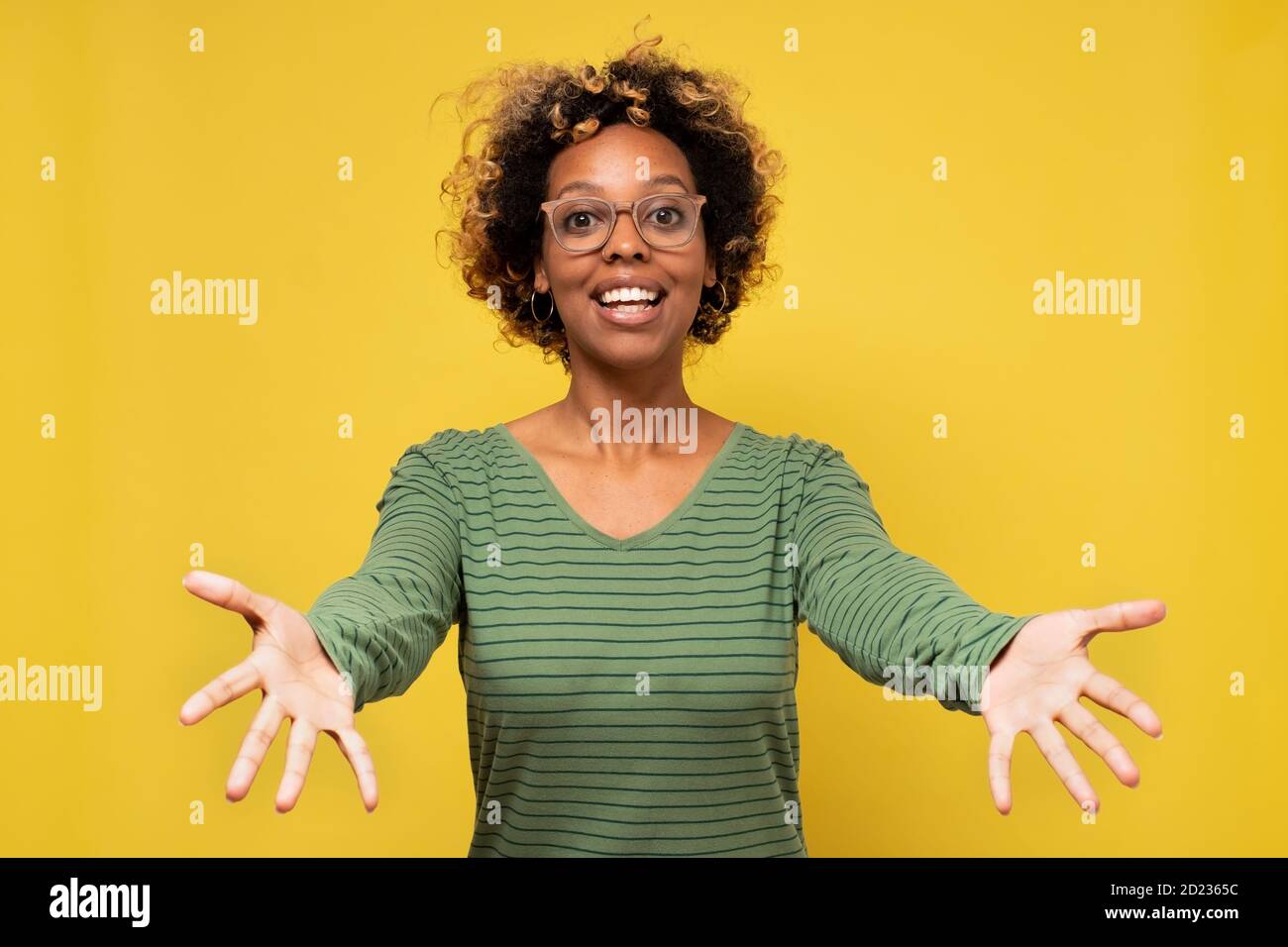 Young african american woman smiling with open arms for hug