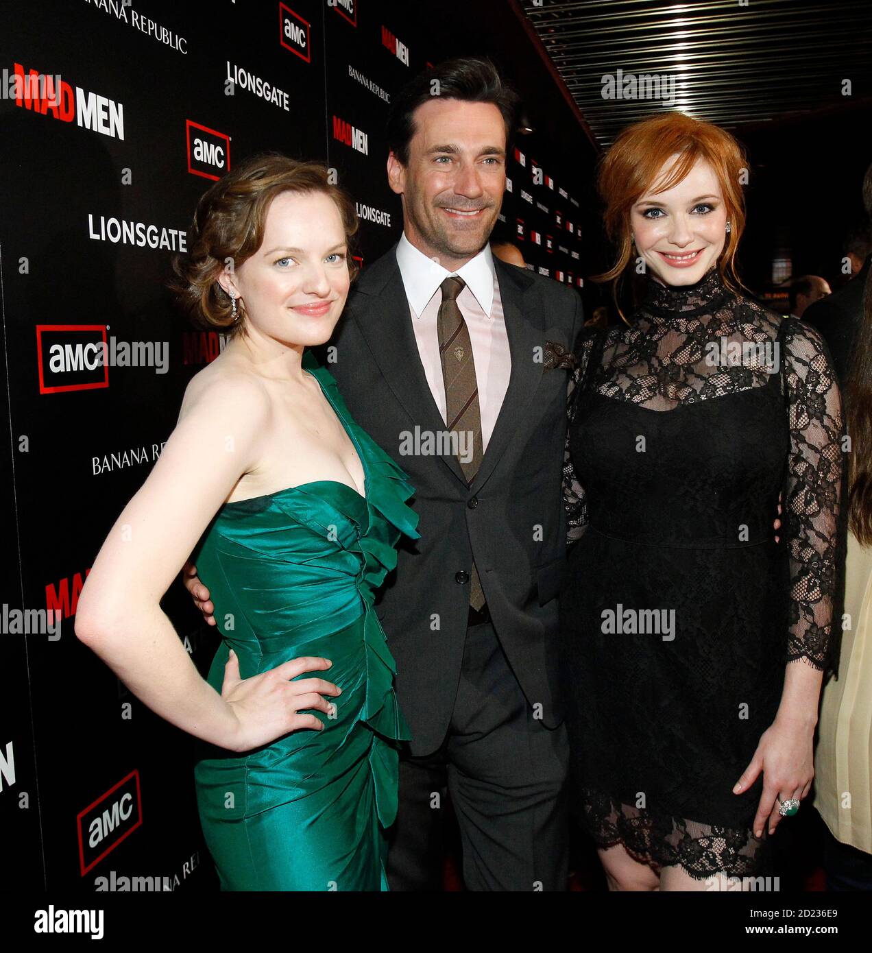 Cast member Jon Hamm (C) poses with co-stars Christina Hendricks (R) and  Elisabeth Moss at the premiere for the fourth season of the television  series "Mad Men" at the Mann 6 theatre